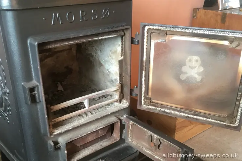 Morsø wood burning stove inspection and chimney sweep — sooty firebox, overdue sweep, NACS registered, Allchimney Sweeps, Romford